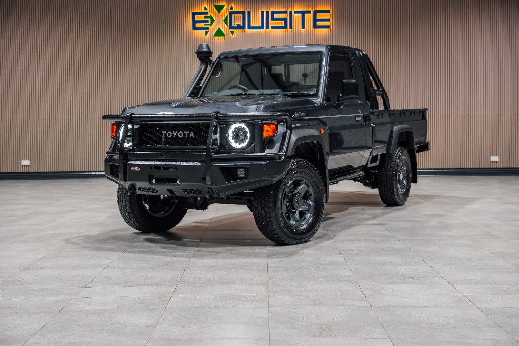 Toyota Land Cruiser 70 Series single-cab pickup in dark grey with bull bar and snorkel